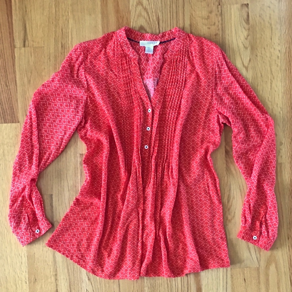 Red blouse size Medium with white diamond design